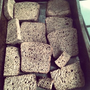 Step 1) Cut up a fresh loaf of Russian black bread and toast in the oven
